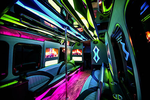 inside party bus with dance pole